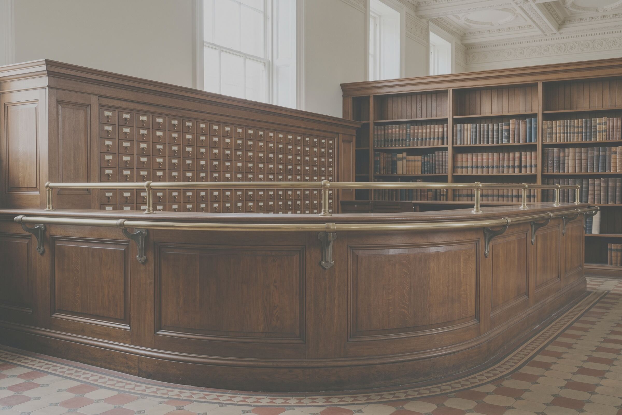 Issue desk, oak counter, Glasgow. The whole frame as shot; the licensed crop is drawn on it.